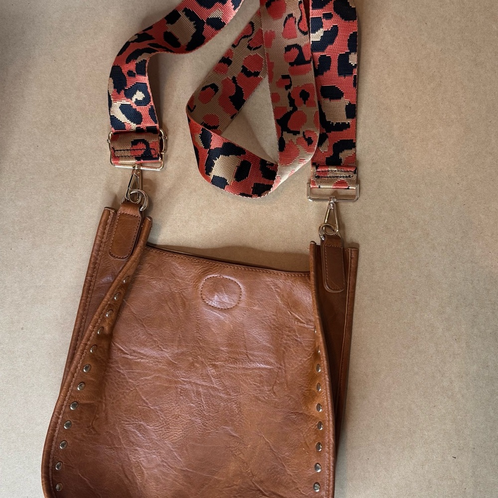Stylish Brown Leather Bag with Leopard Strap